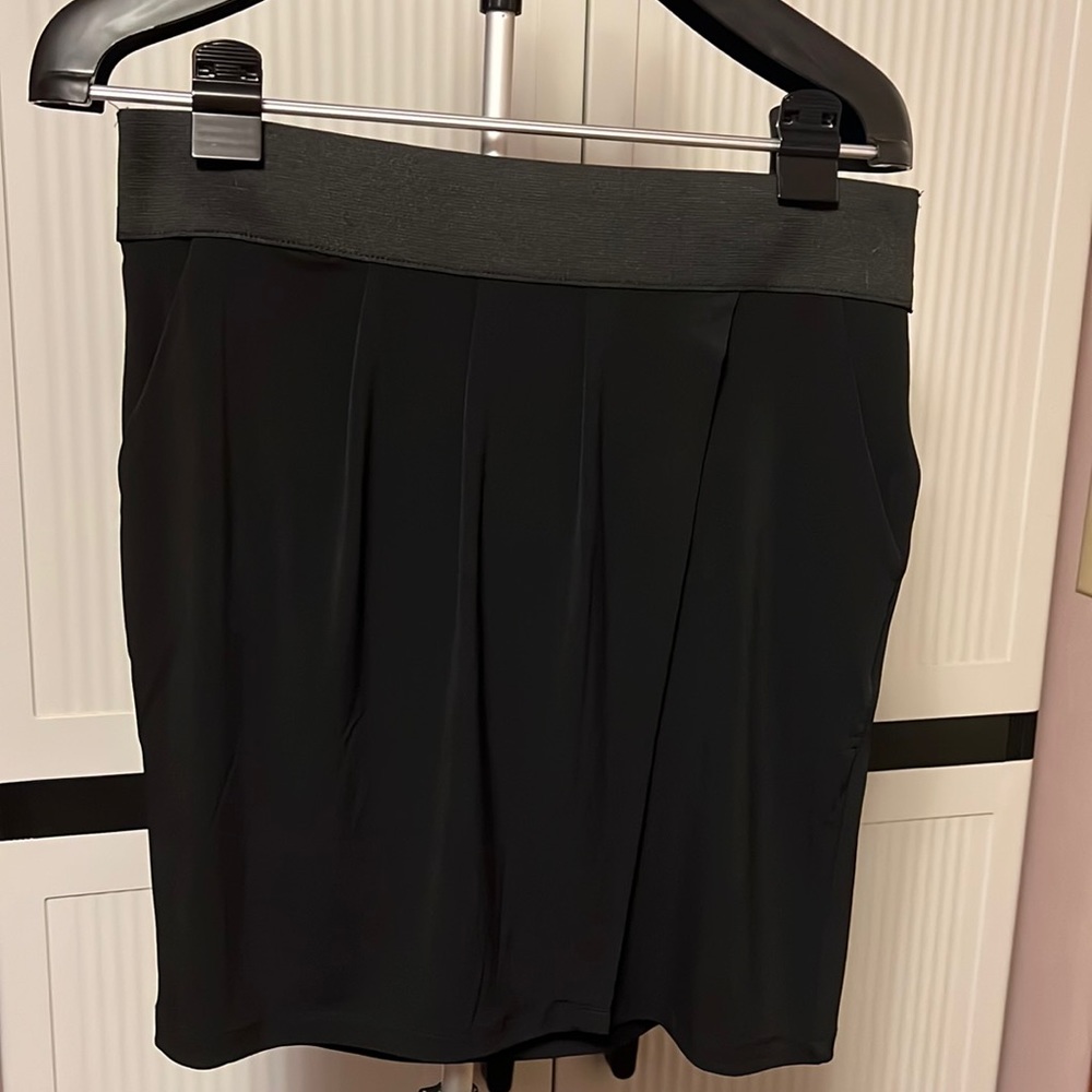 Ladies size medium petite black pull-on skirt.